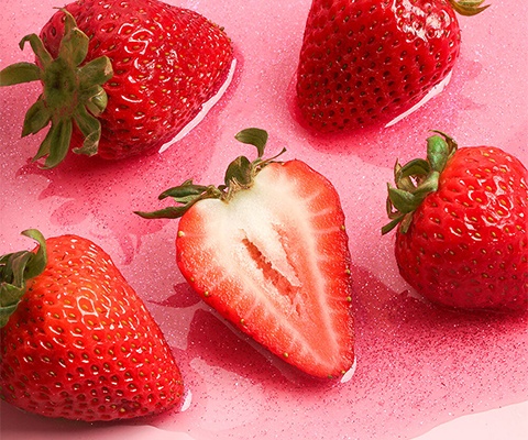 strawberrys in sparkly pink liquid